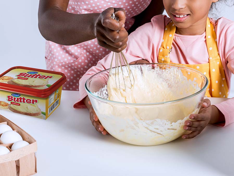 Mother and daughter using Alfresh Salted Butter to bake