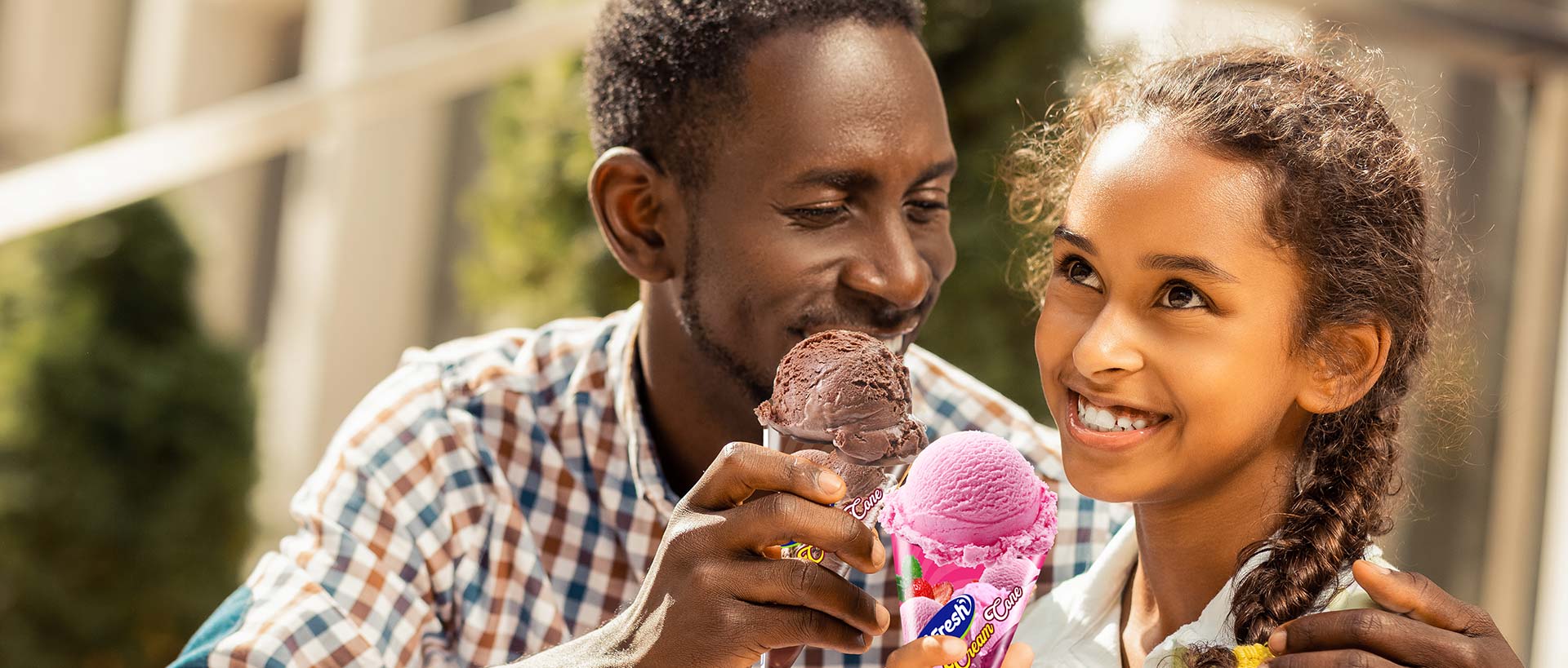 Canaan Factories Limited - Father and daughter enjoying ice cream cones